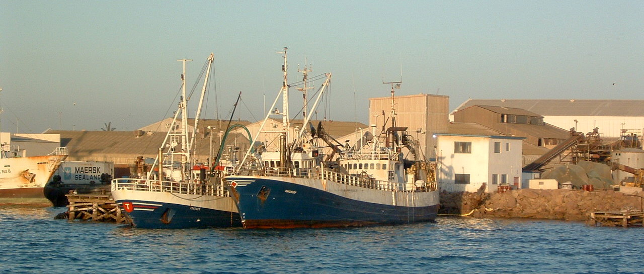 Two fishing boats docked.
